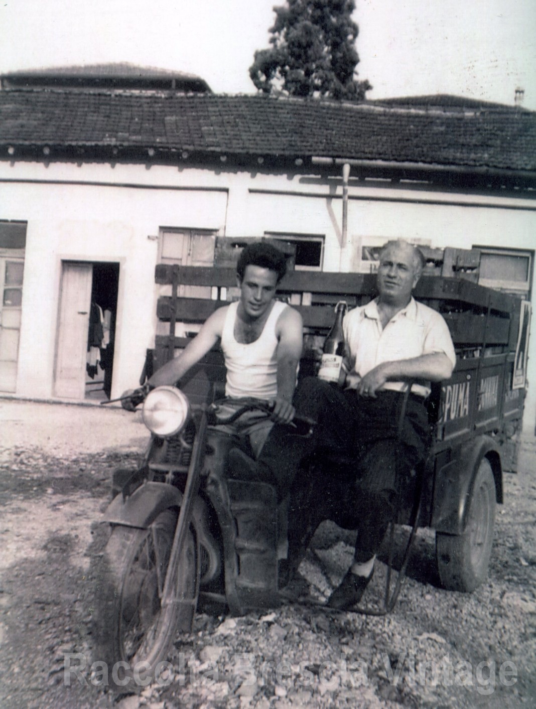 Mio padre, giovane immigrato, sul motofurgone col quale consegnava le bibite e l'acqua a domicilio. Via Chiusure 1952 , Brescia.